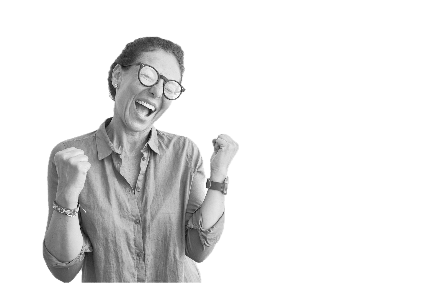 Black & white portrait of a female leader with hands clenched and expression of celebration
