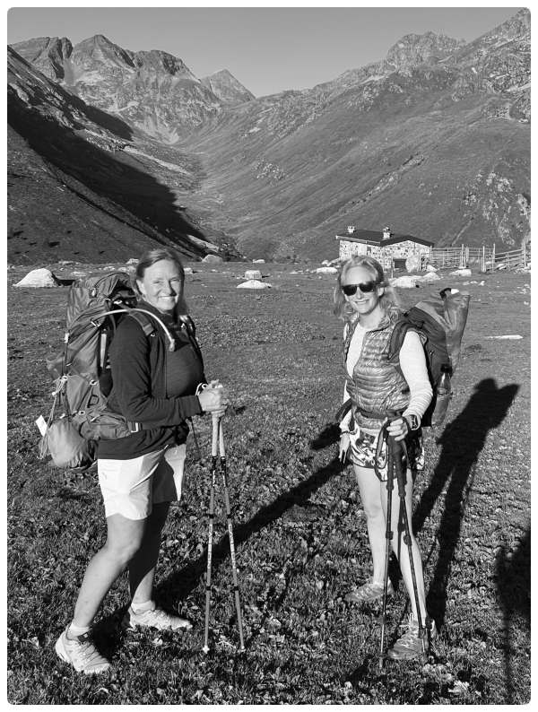 Black and white natural portrait of Angela Philp and Anne Arran hiking in the mountains