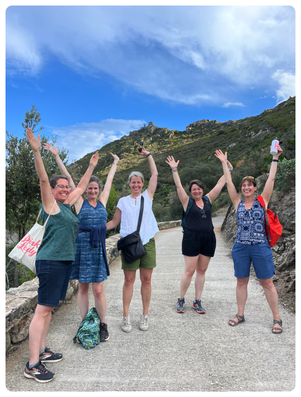 Colour natural portrait of a group of women hiking on a coastal path during a vision quest adventure